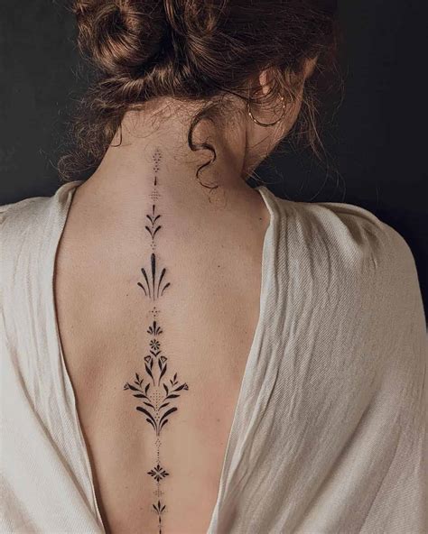 women's back tattoo ideas|spine tattoos for black females.